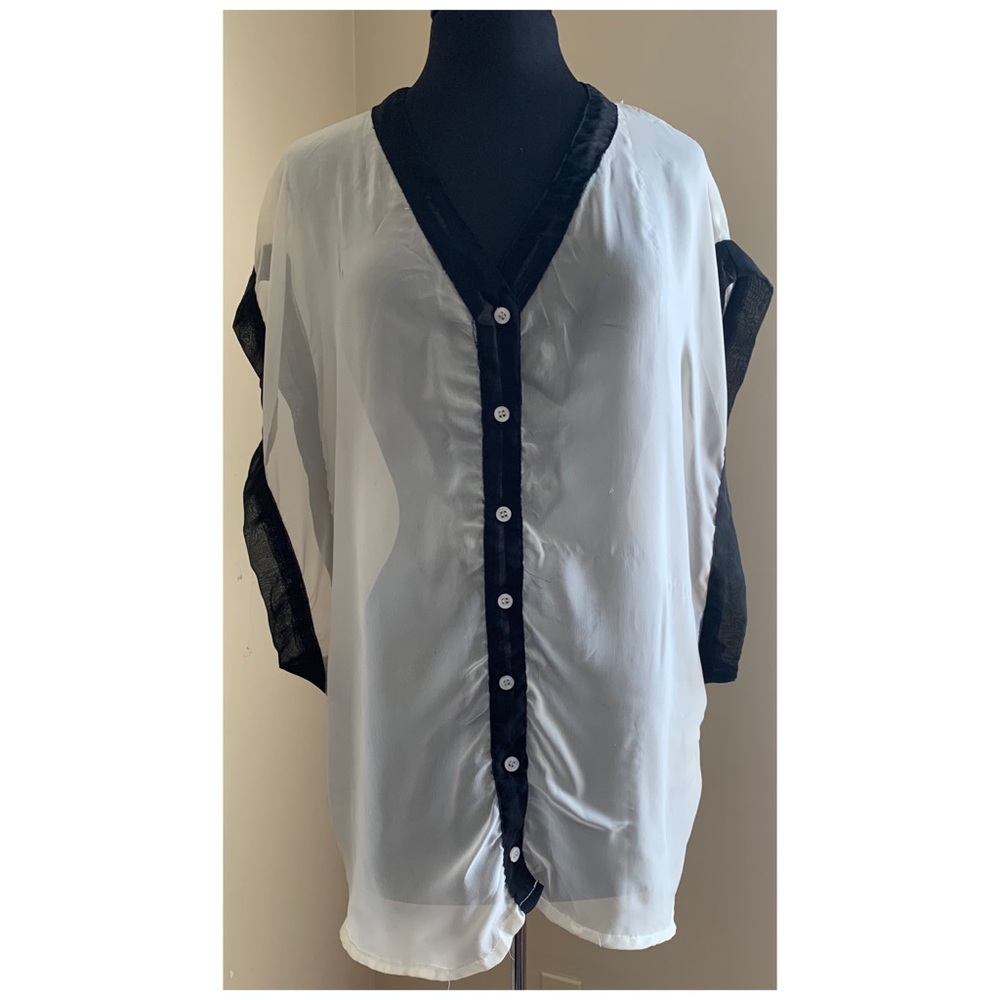 Erica Brooke Open Sleeve Cut Out Fringe Blouse